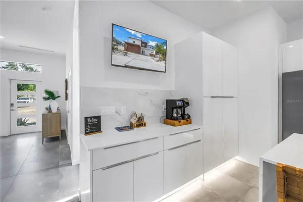 a kitchen with stainless steel appliances granite countertop a refrigerator and a stove