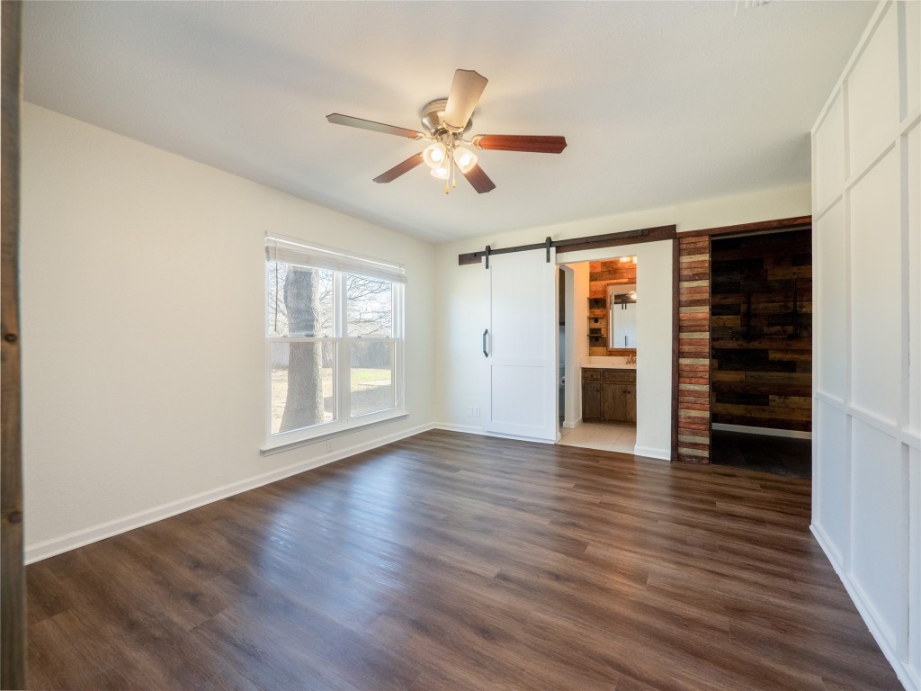 3209 Buffalo Springs Trail Georgetown, TX 78628 - Photo 14 of 32 a view of an empty room with a window and wooden floor