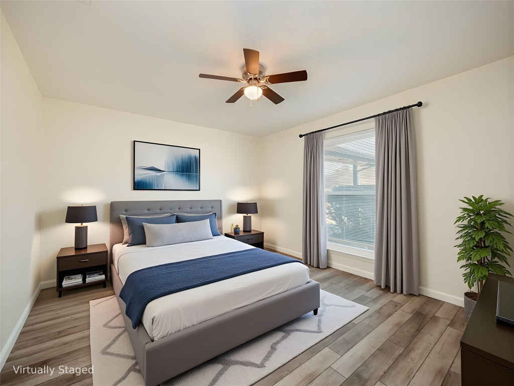 3209 Buffalo Springs Trail Georgetown, TX 78628 - Photo 18 of 32 a bedroom with a large bed and a chandelier