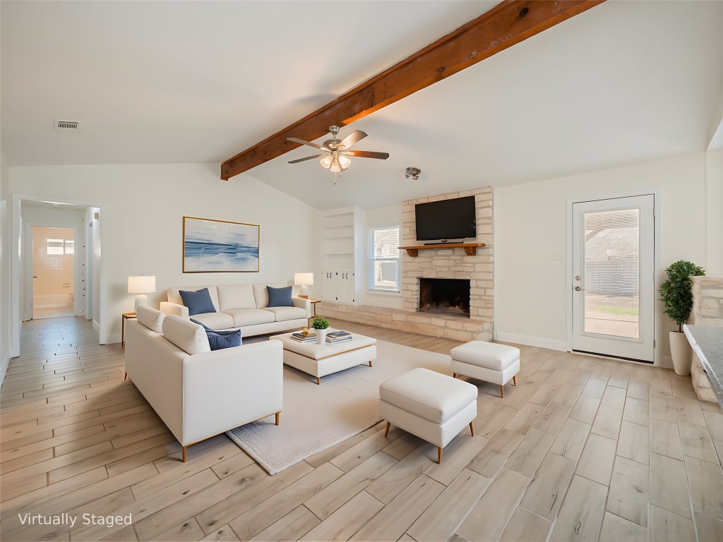 3209 Buffalo Springs Trail Georgetown, TX 78628 - Photo 4 of 32 a living room with furniture and a fireplace