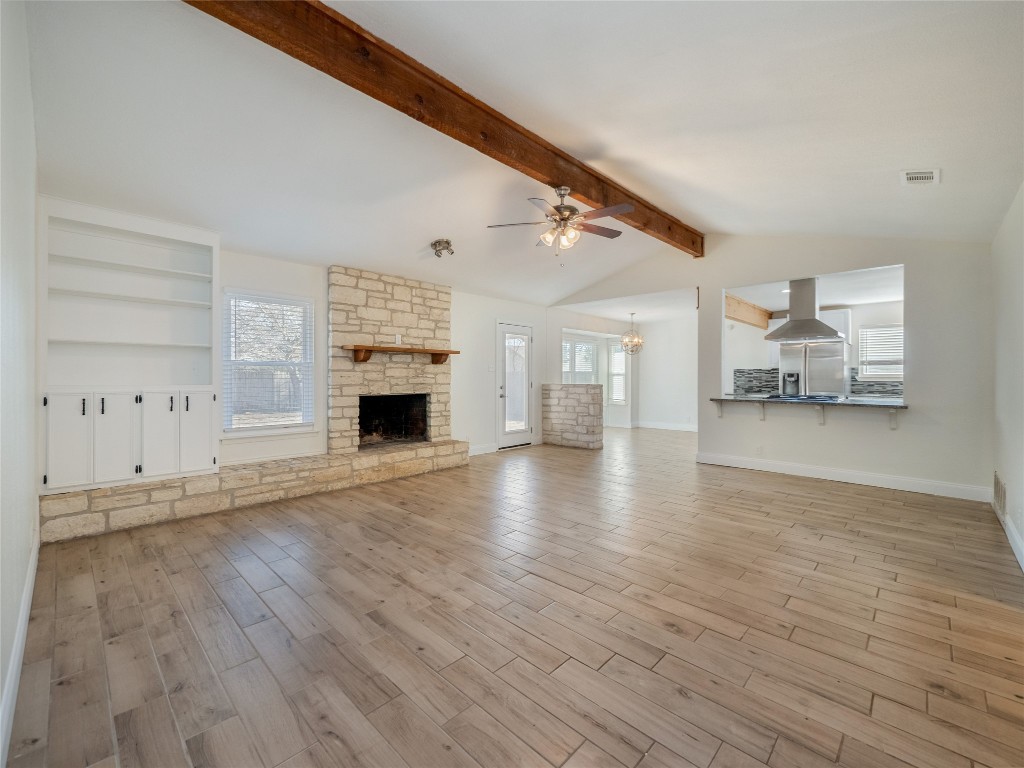 3209 Buffalo Springs Trail Georgetown, TX 78628 - Photo 5 of 32 a view of a livingroom with wooden floor and fireplace