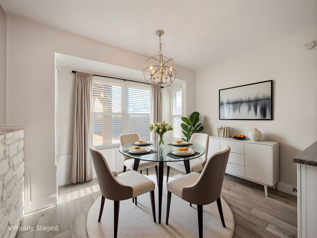 3209 Buffalo Springs Trail Georgetown, TX 78628 - Photo 7 of 32 a dining room with furniture a large window and wooden floor