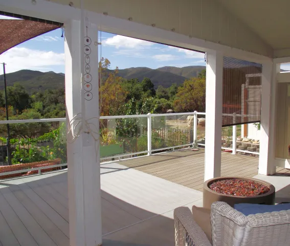 a living room with a large window and a table