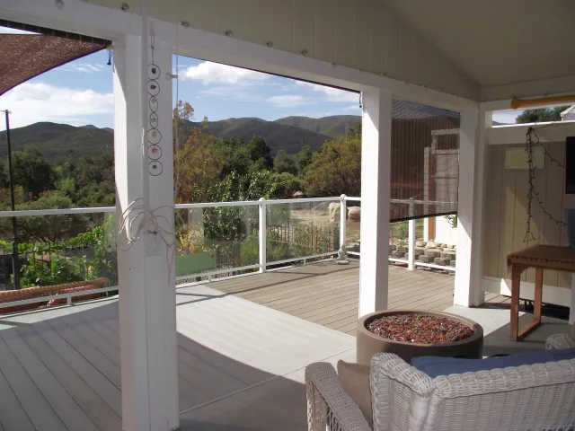 a front view of a house with outdoor seating
