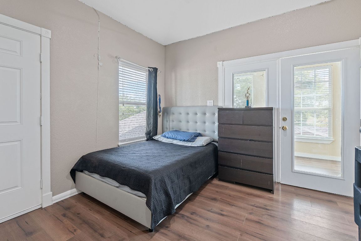 169 Ridgetop Road Buda, TX 78610 - Photo 18 of 40 a bedroom with a bed and window