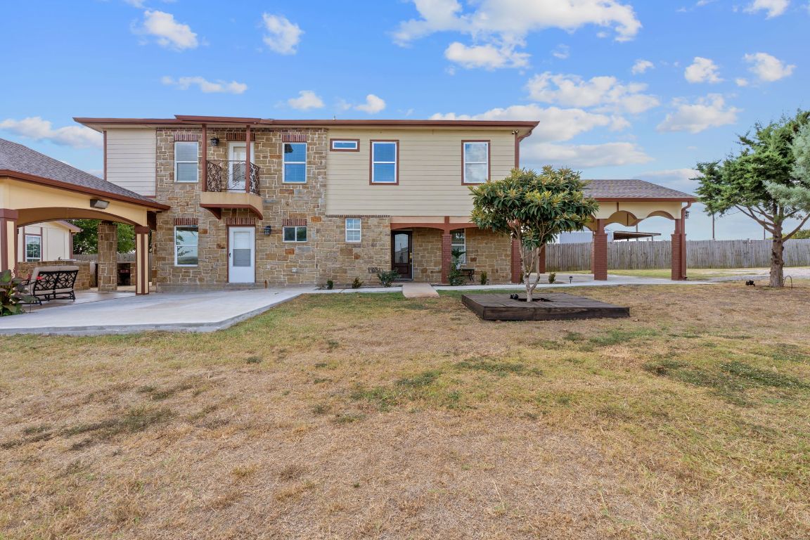 169 Ridgetop Road Buda, TX 78610 - Photo 2 of 40 a view of a house with entertaining space