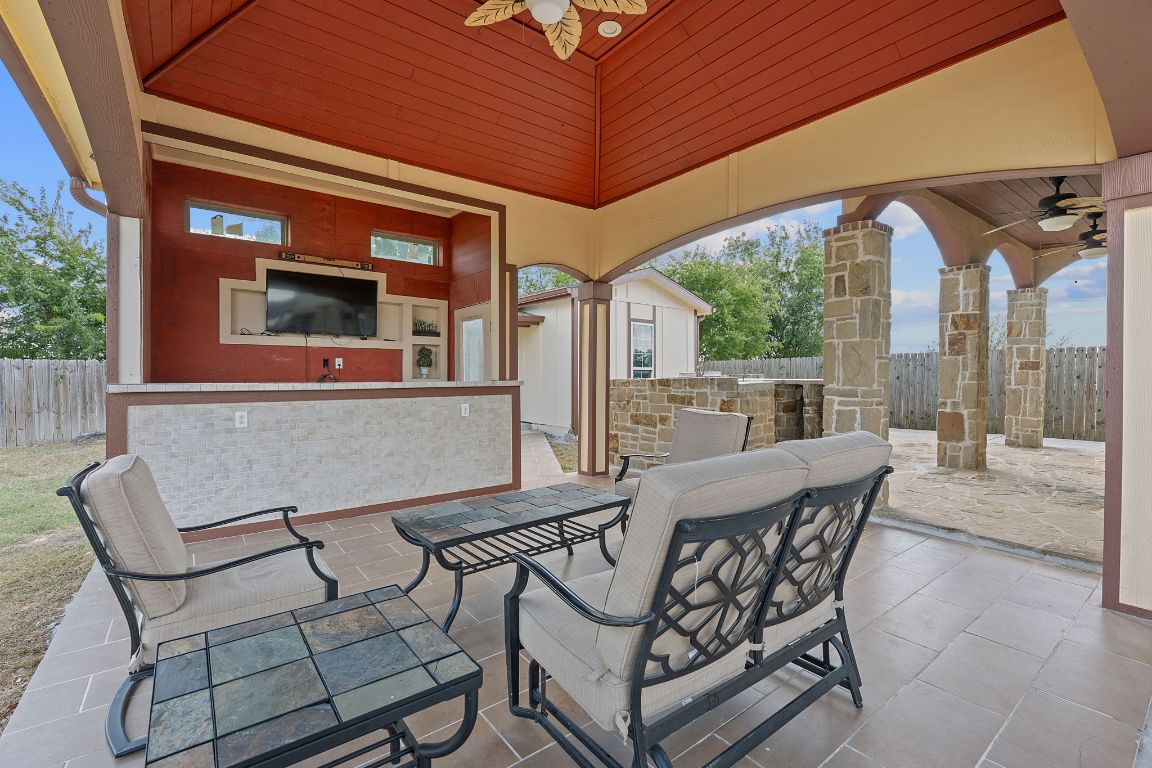 169 Ridgetop Road Buda, TX 78610 - Photo 21 of 40 a view of a patio with a table and chairs