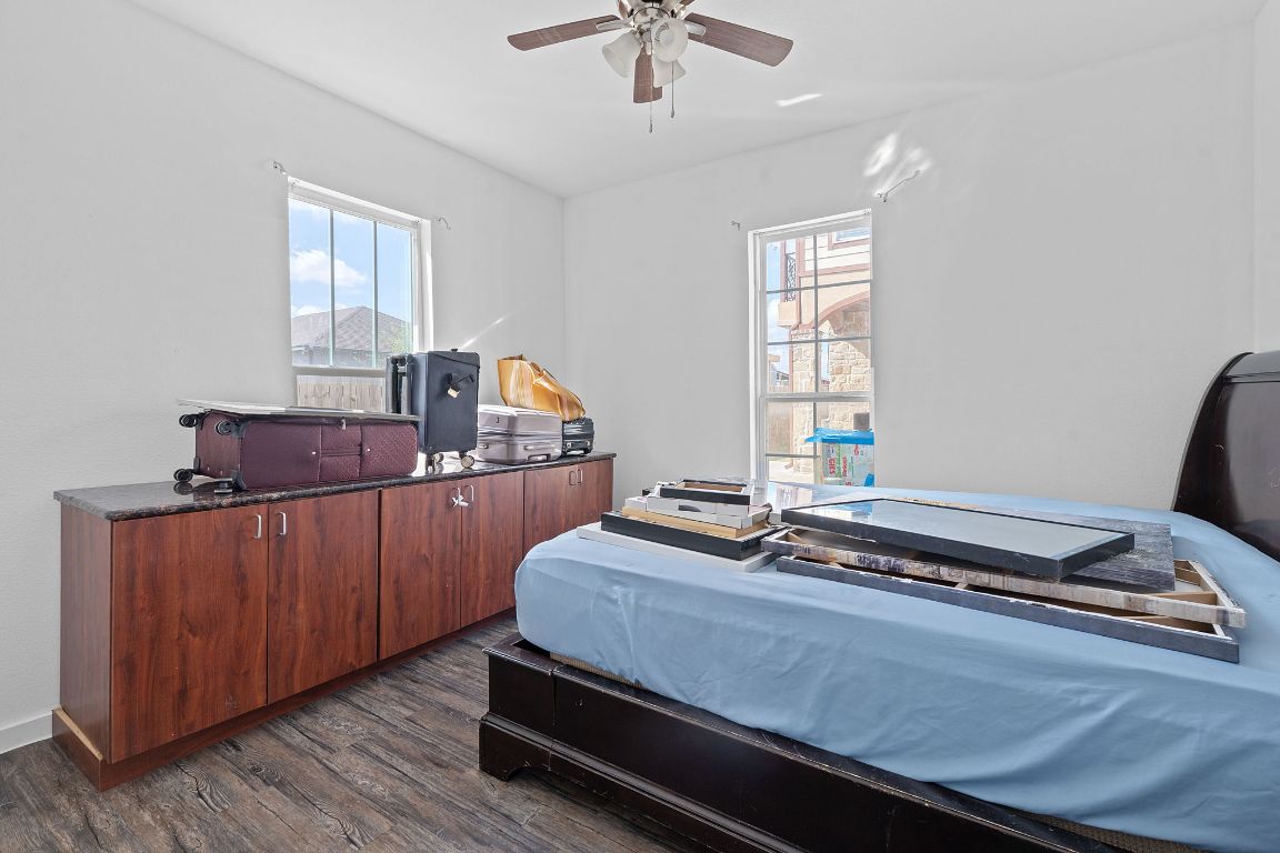 169 Ridgetop Road Buda, TX 78610 - Photo 28 of 40 a bed room with a bed and window