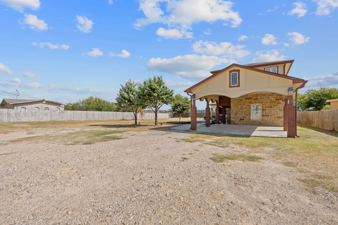 169 Ridgetop Road Buda, TX 78610 - Photo 36 of 40 a front view of a house with a yard