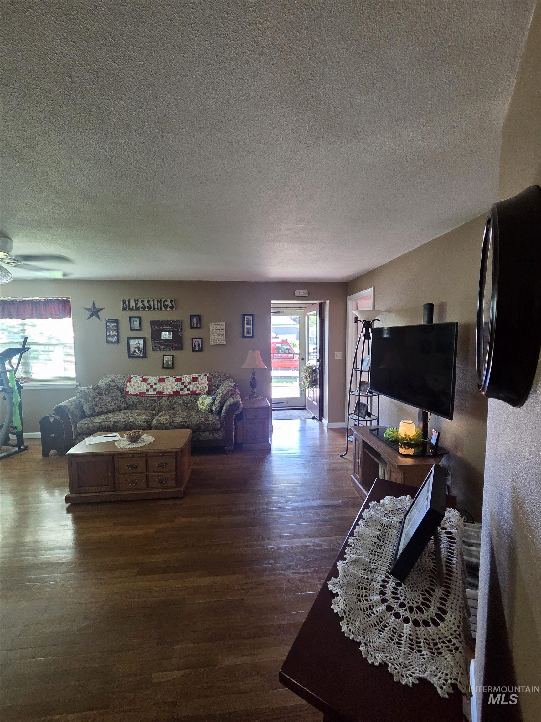 109 South 3rd Street Pomeroy, WA 99347 - Photo 5 of 36 Open concept living area featuring wood-finish flooring
