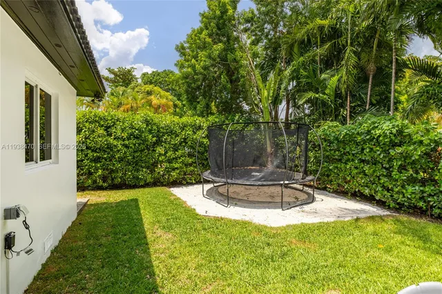 a view of a backyard with plants