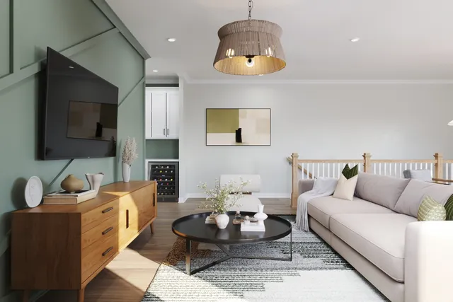a living room with furniture a flat screen tv and kitchen view