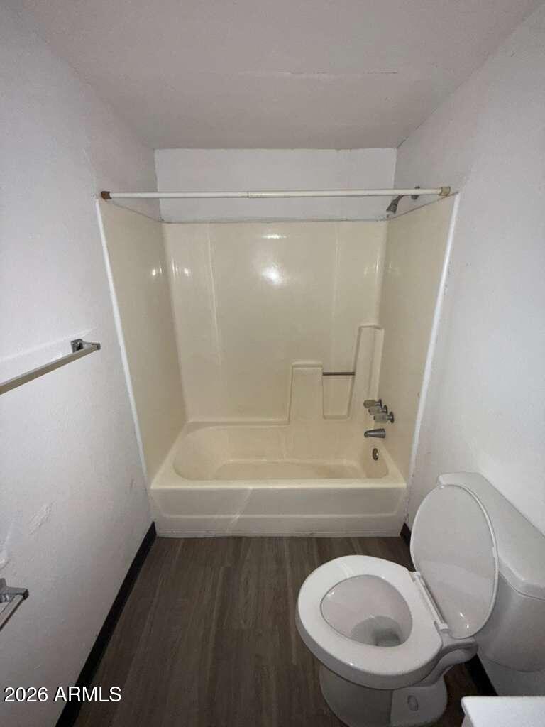 396 North E Avenue Douglas, AZ 85607 - Photo 11 of 14 a bathroom with a toilet and a bathtub