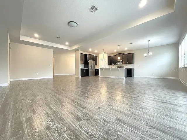 a view of a kitchen with a sink and a stove