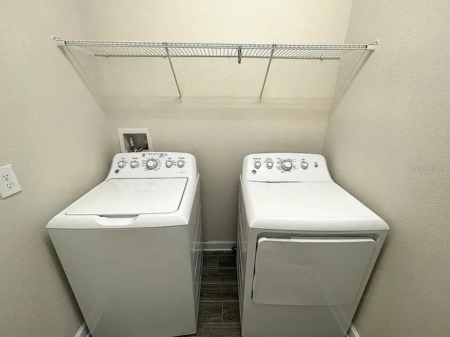a utility room with dryer and washer