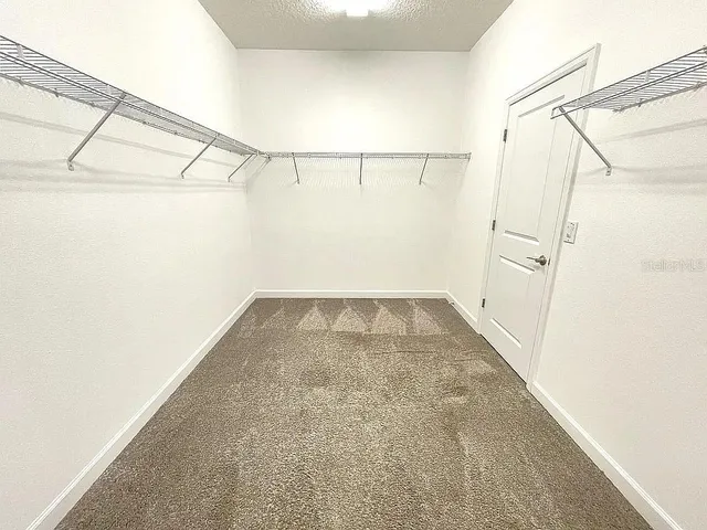 a view of a room with racks on the wall