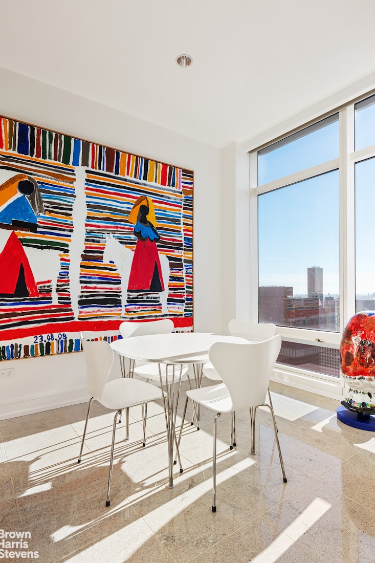 151 East 58th Street, Unit 43E Manhattan, NY 10022 - Photo 9 of 50 a living room with furniture and a rug