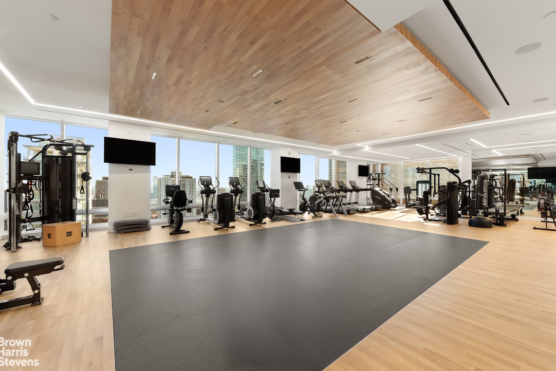 151 East 58th Street, Unit 43E Manhattan, NY 10022 - Photo 25 of 50 a view of a room with gym equipment
