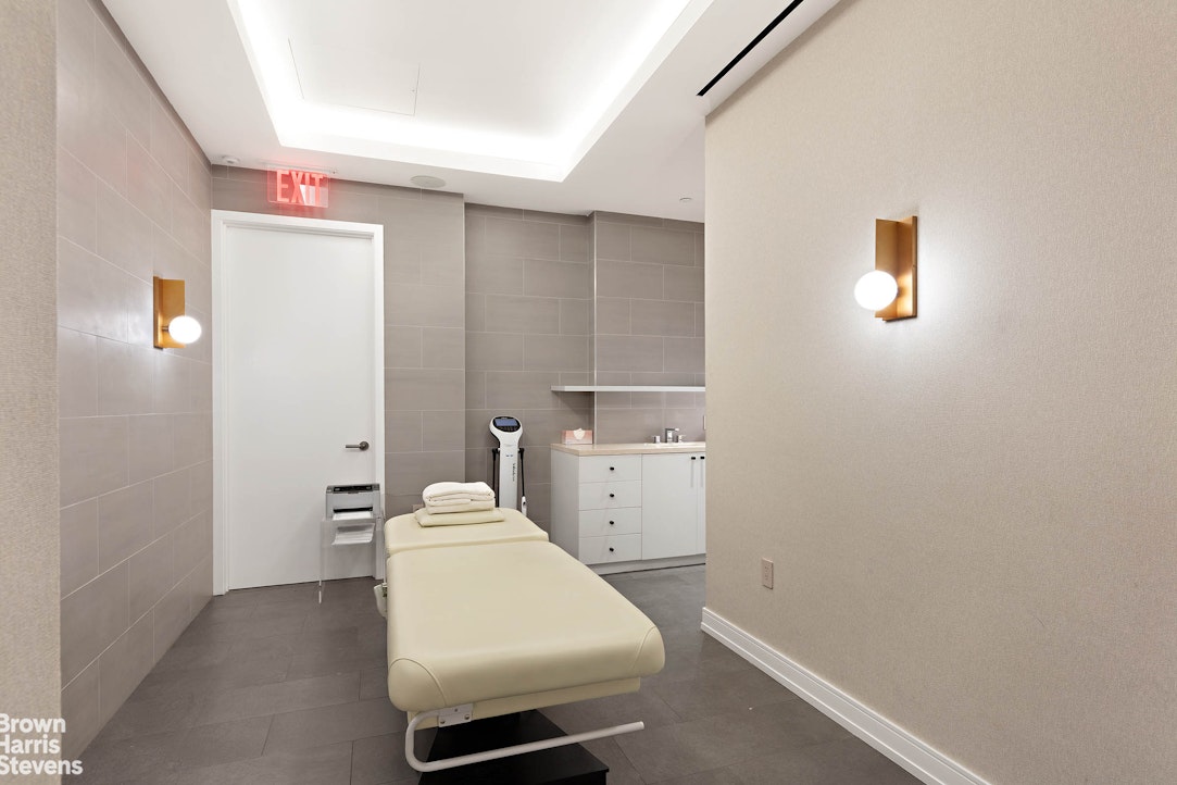 151 East 58th Street, Unit 43E Manhattan, NY 10022 - Photo 26 of 50 a room with a refrigerator and washer