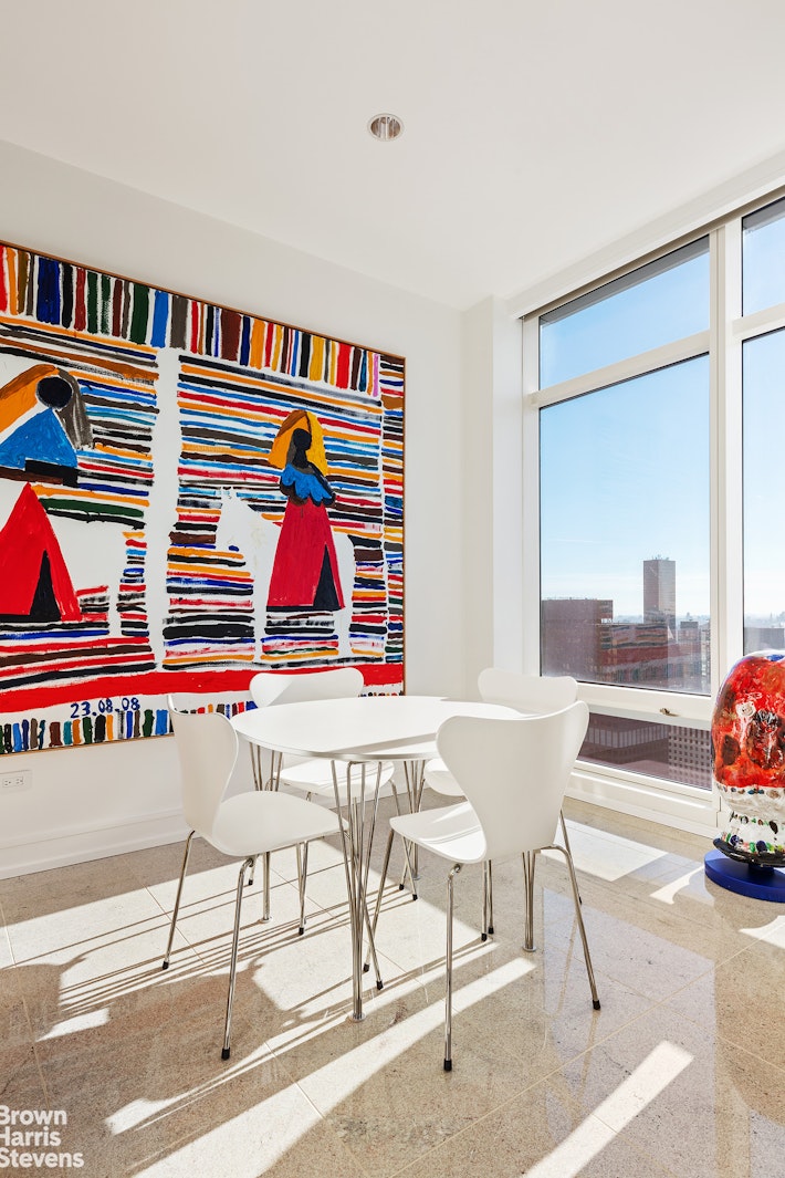 151 East 58th Street, Unit 43E Manhattan, NY 10022 - Photo 32 of 50 a living room with furniture and a rug