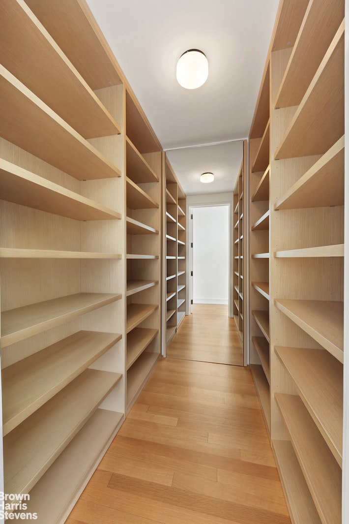 151 East 58th Street, Unit 43E Manhattan, NY 10022 - Photo 36 of 50 a view of walk in closet with empty racks