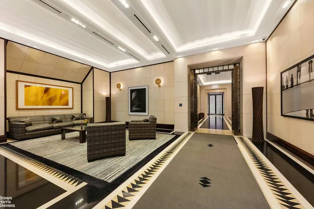 a living room with furniture and a rug