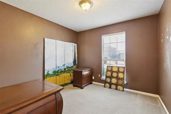 a view of room with furniture and wooden floor