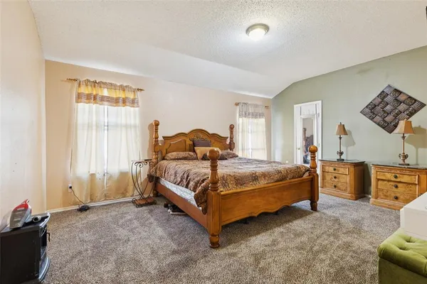 a bed room with a bed and a window