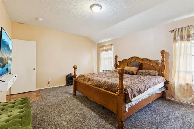 a bathroom with a tub a sink and a mirror
