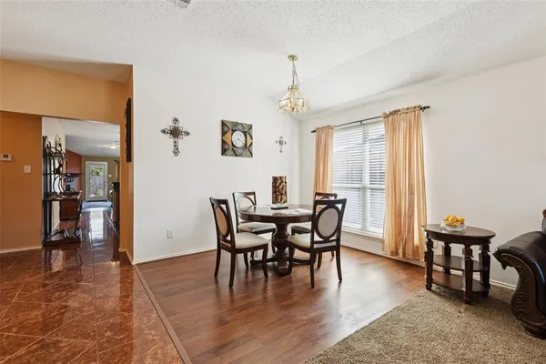 a view of a dining room with furniture and window