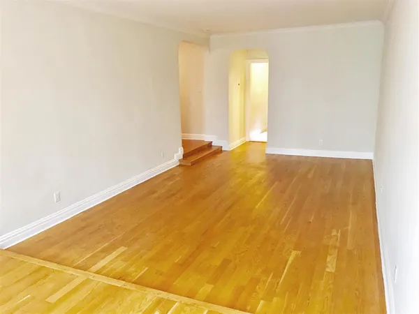 a view of a big room with windows