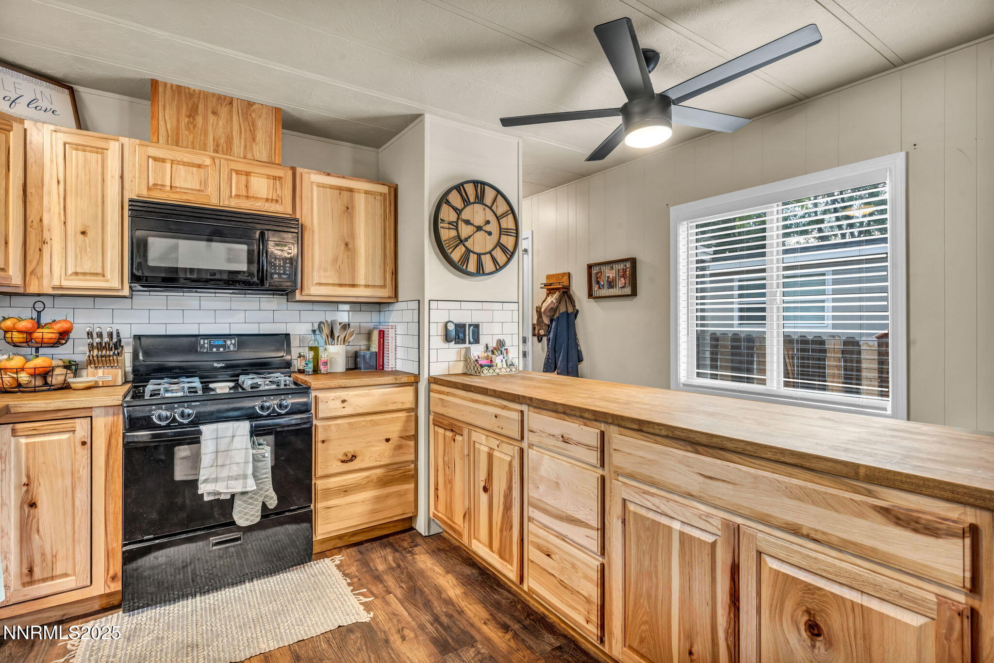 16260 Rhyolite Circle Reno, NV 89521 - Photo 5 of 18 a kitchen with stainless steel appliances granite countertop a stove and a sink