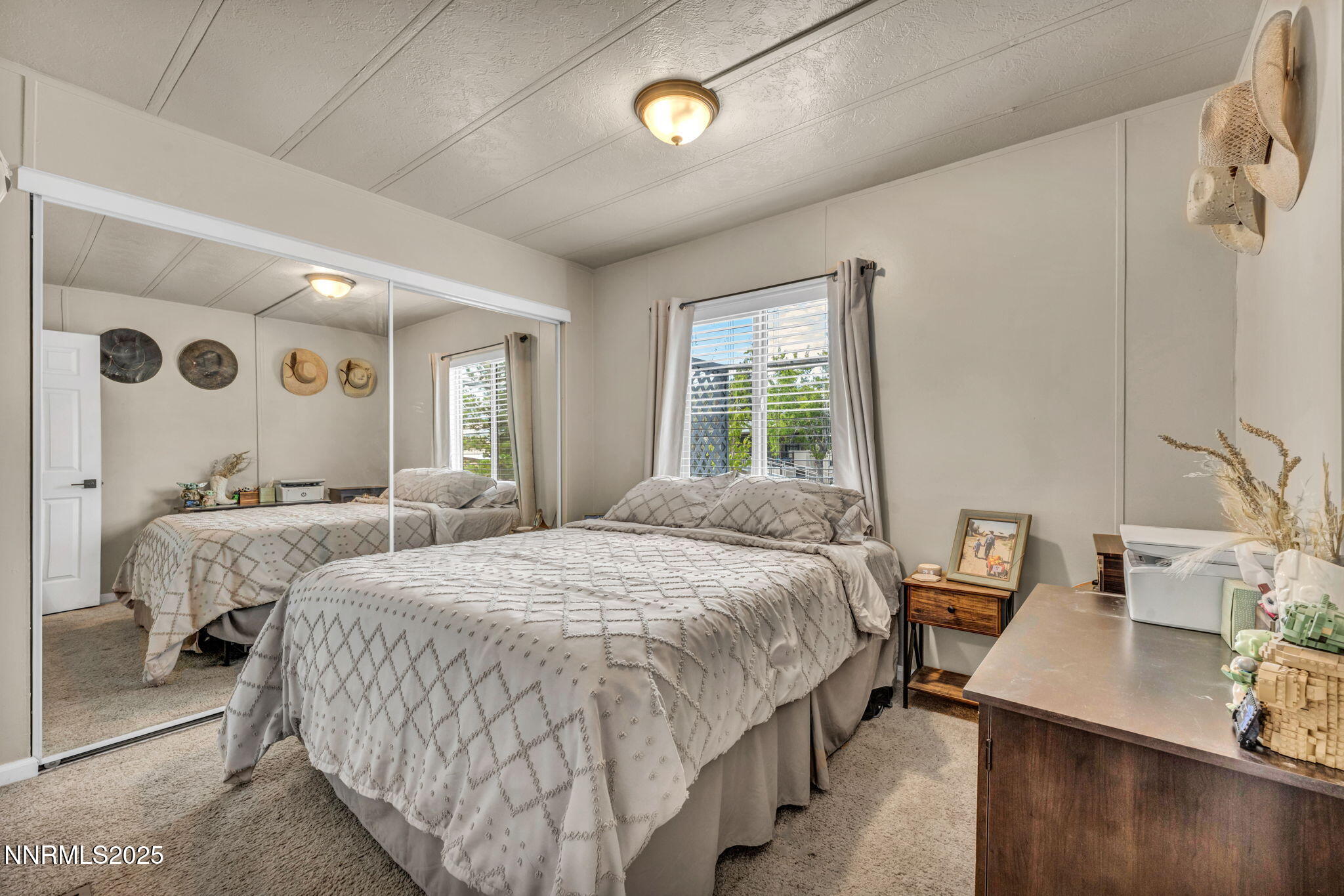 16260 Rhyolite Circle Reno, NV 89521 - Photo 9 of 18 a bedroom with a bed and a table