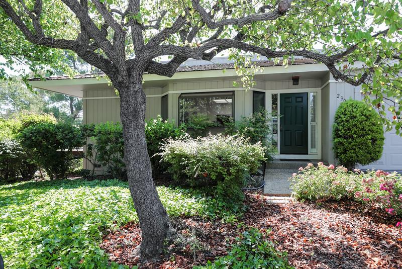 23030 Stonebridge Cupertino, CA 95014 - Photo 1 of 14 front view of a house with a yard