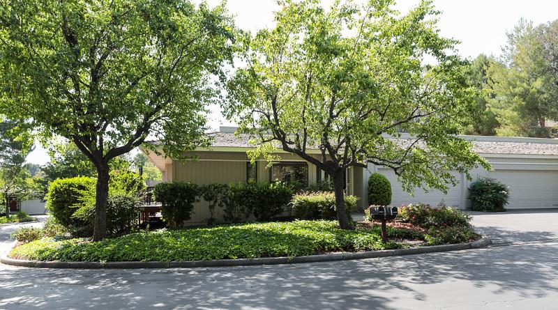 23030 Stonebridge Cupertino, CA 95014 - Photo 13 of 14 a front view of a house with garden