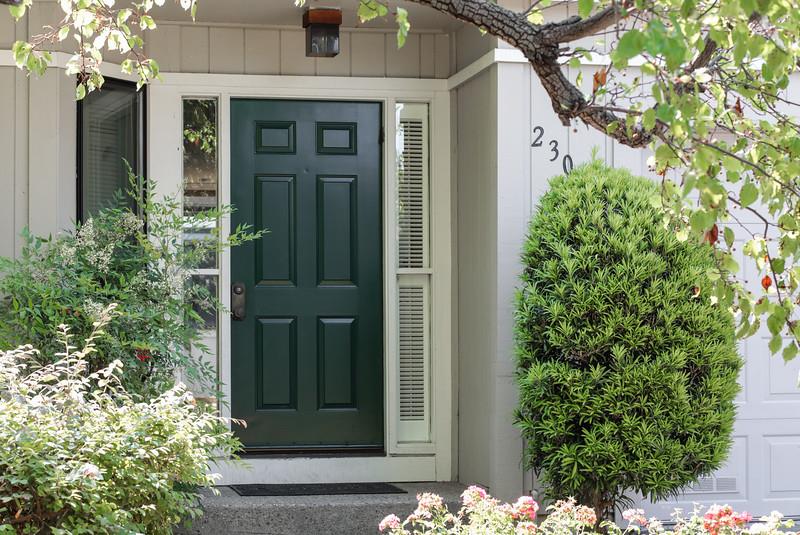 23030 Stonebridge Cupertino, CA 95014 - Photo 3 of 14 front view of a house with a tree