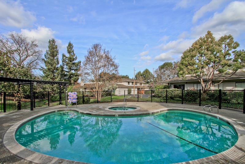 23030 Stonebridge Cupertino, CA 95014 - Photo 6 of 14 a view of a swimming pool with an outdoor space and seating area