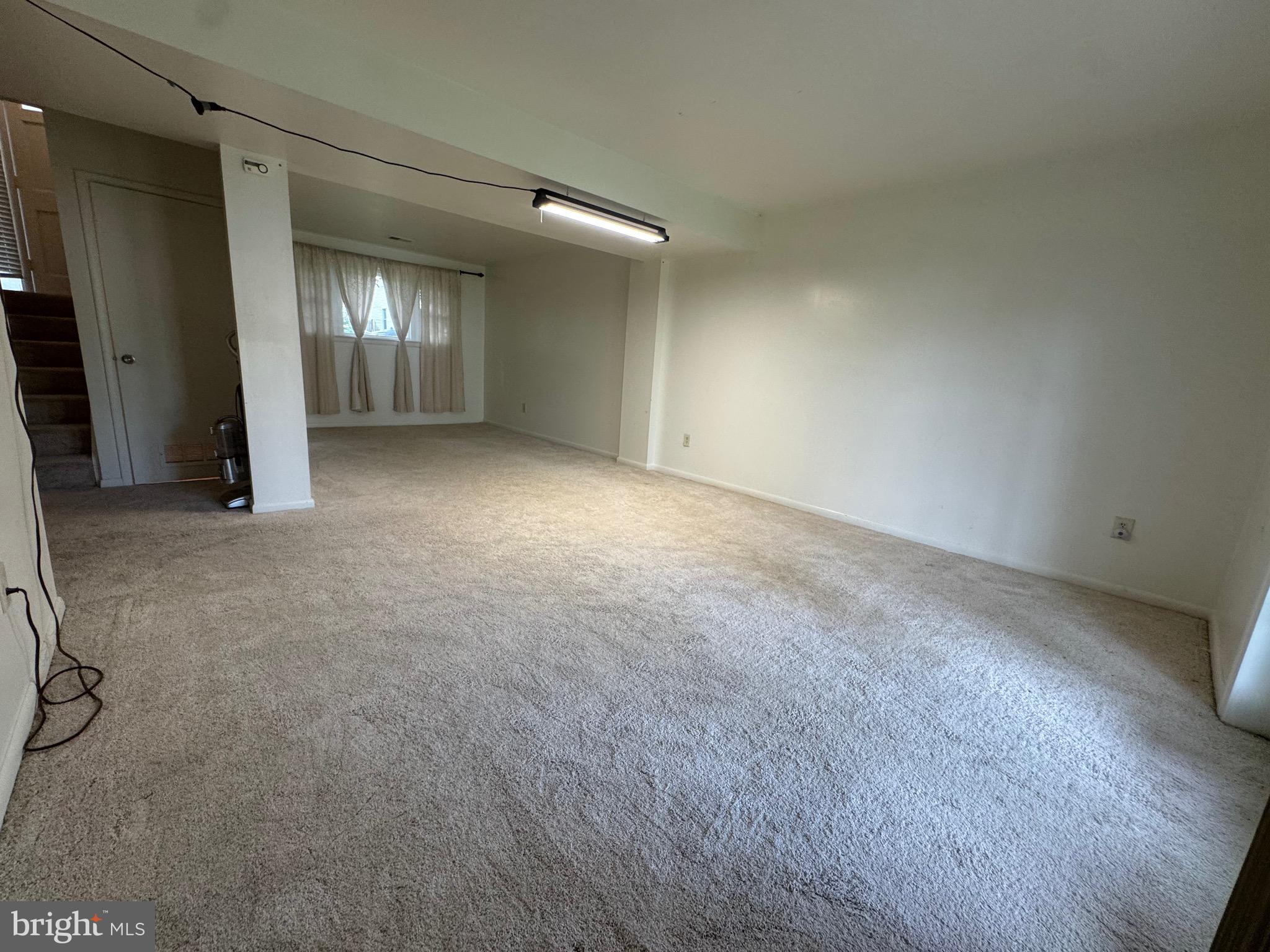 212 11th Street Laurel, MD 20707 - Photo 23 of 39 an empty room with window and pillar in it