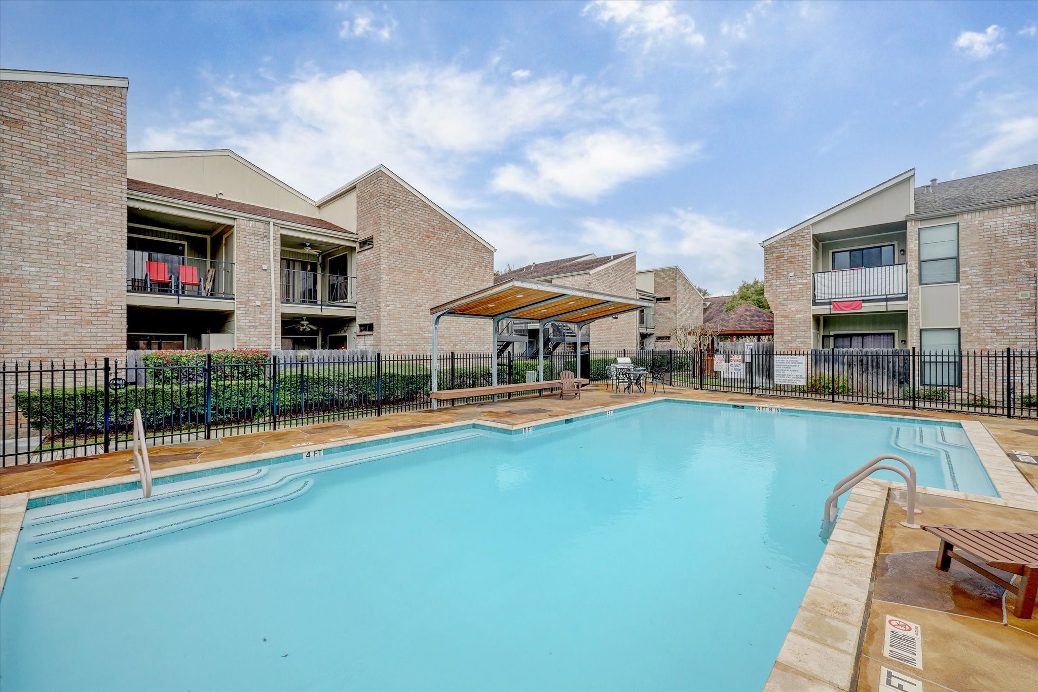 8100 Cambridge Street, Unit 123 Houston, TX 77054 - Photo 11 of 31 a swimming pool with outdoor seating and yard