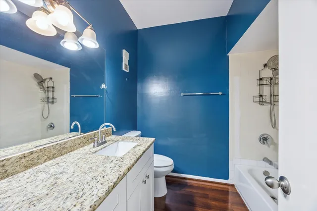 a car parked in front of a white house