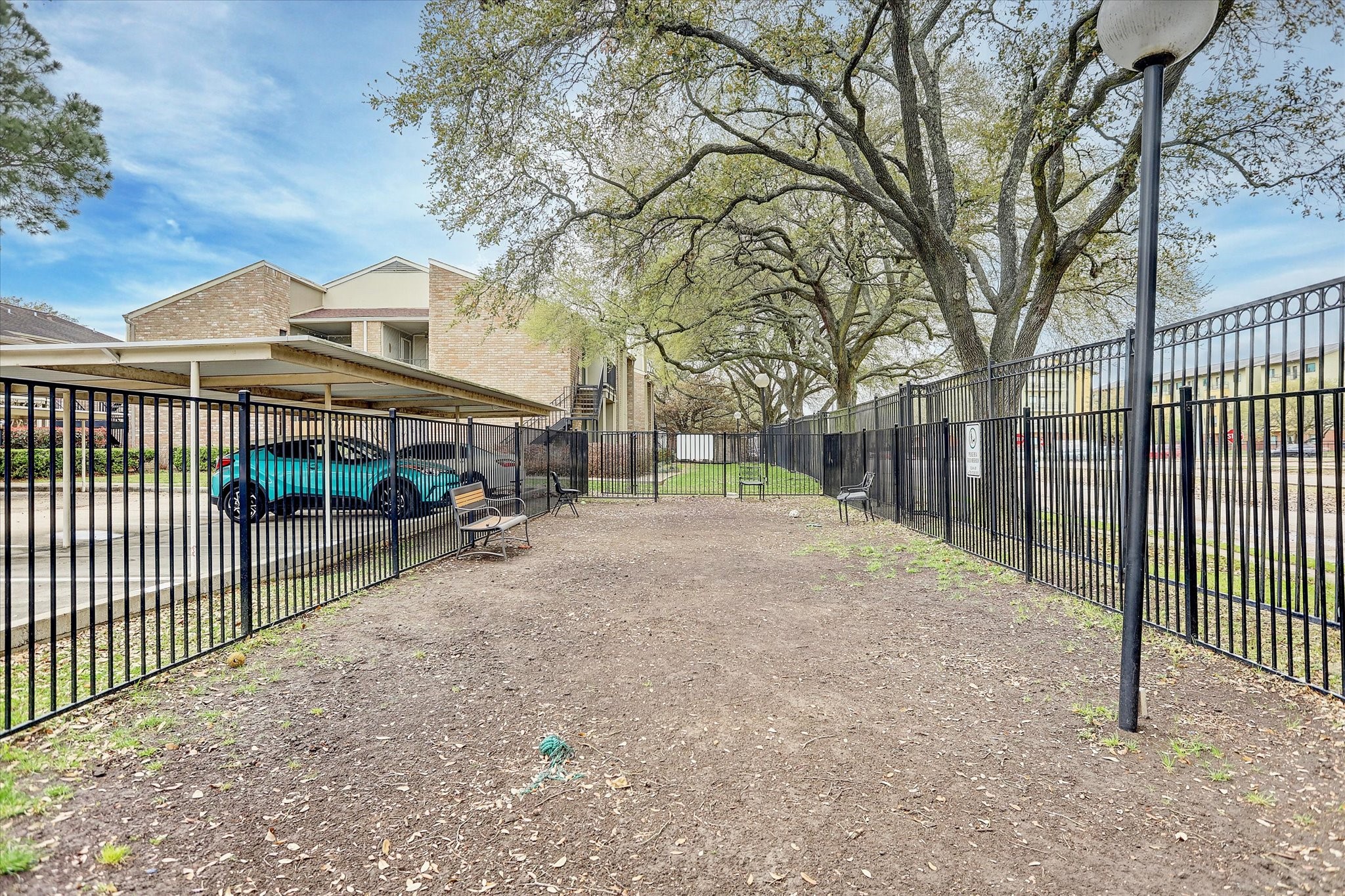 8100 Cambridge Street, Unit 123 Houston, TX 77054 - Photo 19 of 31 a view of street with fence