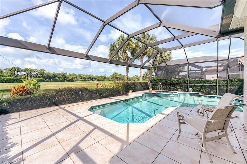 9156 Spring Run Boulevard Estero, FL 34135 - Photo 2 of 34 a view of swimming pool with a patio
