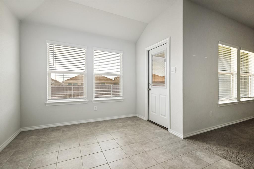 621 Spaulding Street Justin, TX 76247 - Photo 16 of 22 a view of an empty room with a window