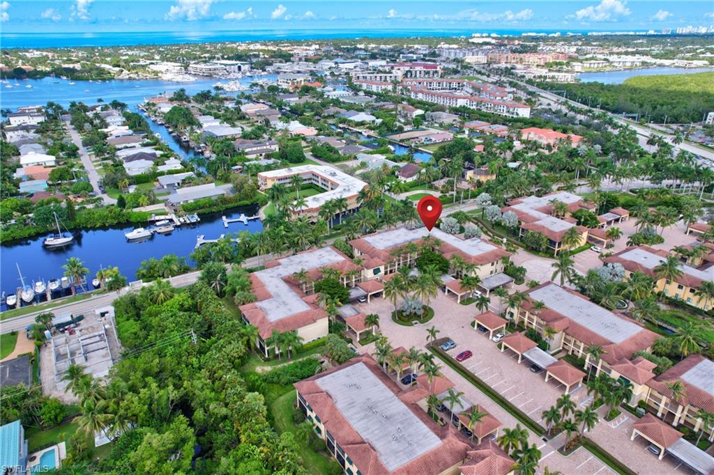 985 Sandpiper Street, Unit I204 Naples, FL 34102 - Photo 37 of 45 an aerial view of a city with lots of residential buildings