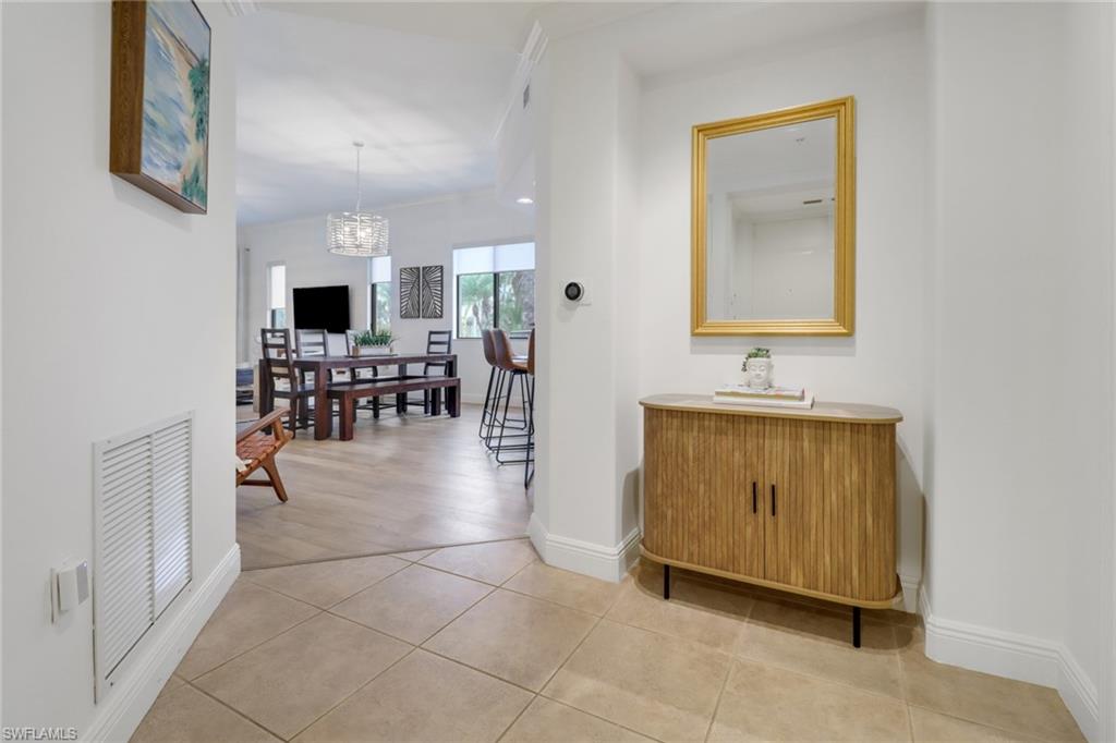 985 Sandpiper Street, Unit I204 Naples, FL 34102 - Photo 10 of 45 a view of dining room with furniture