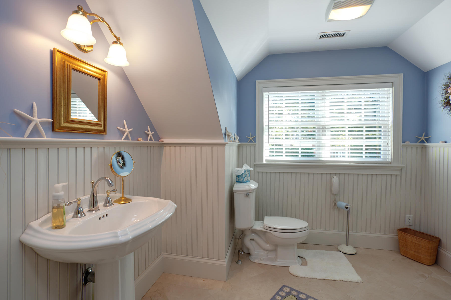 255 Parker Road Osterville, MA 02655 - Photo 25 of 34 a bathroom with a toilet a sink and mirror