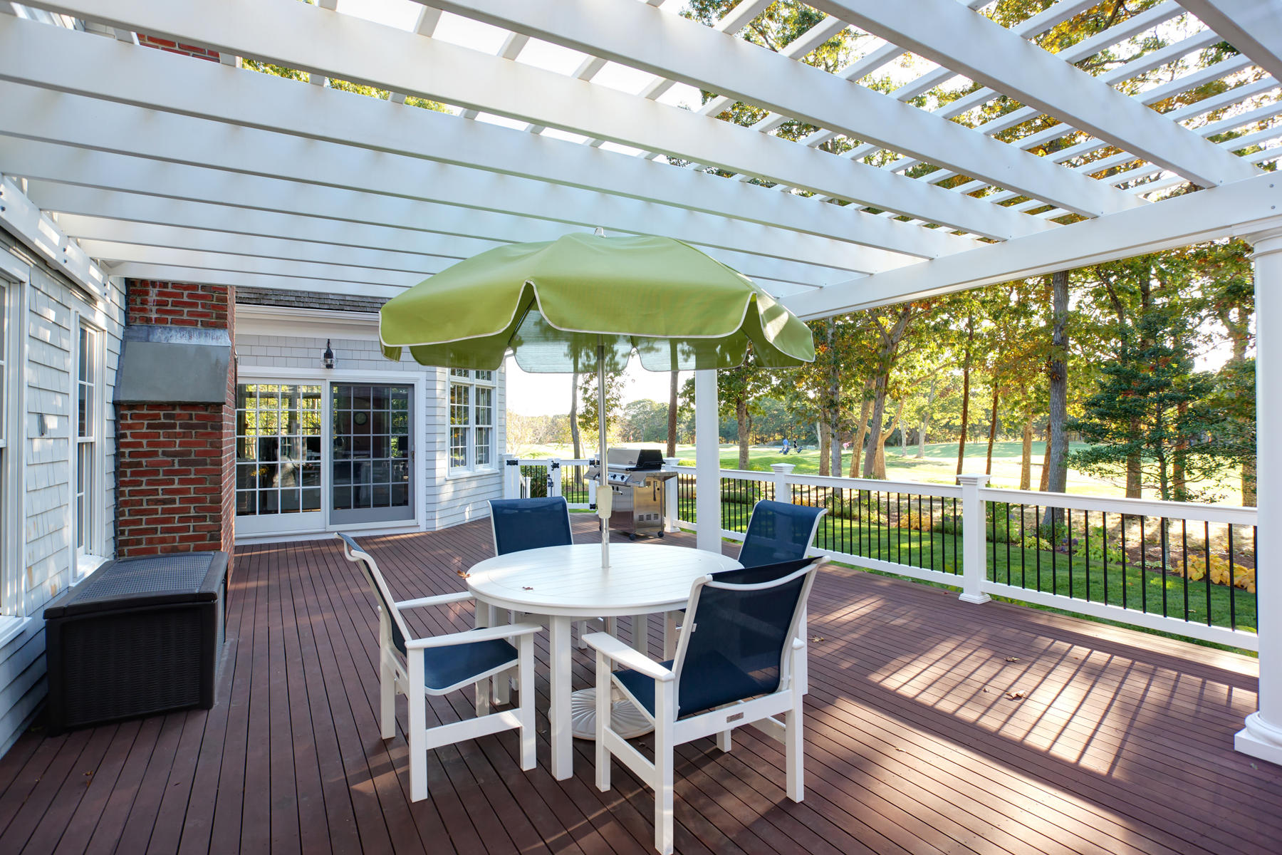 255 Parker Road Osterville, MA 02655 - Photo 32 of 34 a view of a patio with a table chairs and backyard