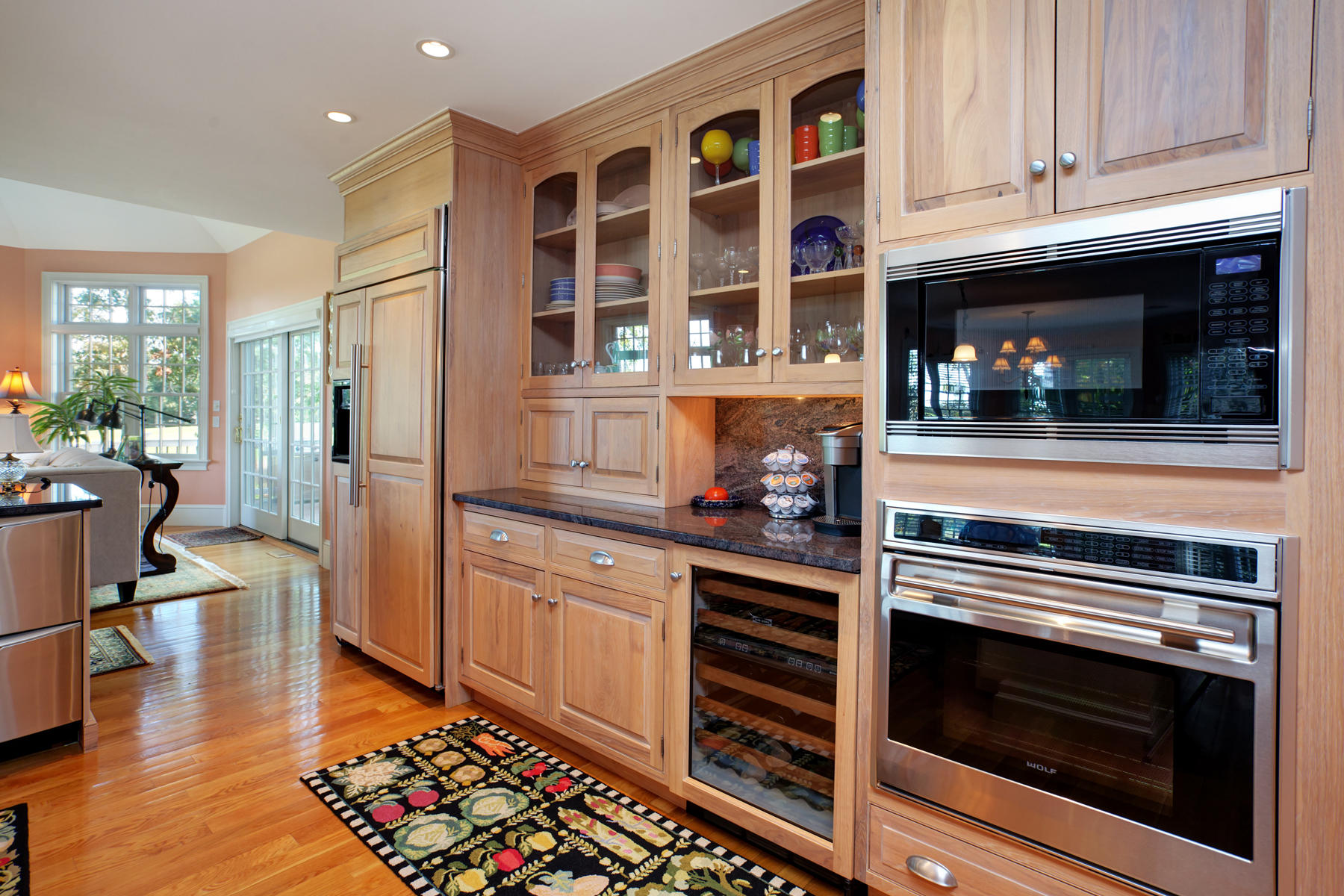 255 Parker Road Osterville, MA 02655 - Photo 9 of 34 a kitchen with stainless steel appliances granite countertop a stove and a microwave