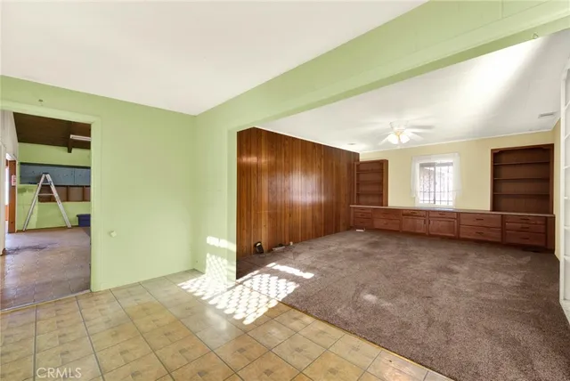 a view of an empty room and window