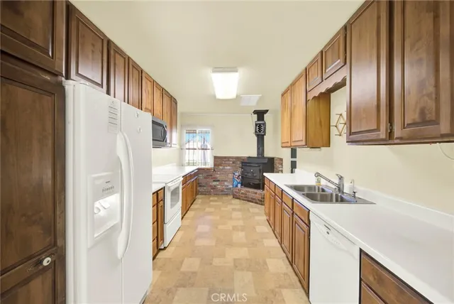 a bathroom with a toilet a sink a vanity and mirror